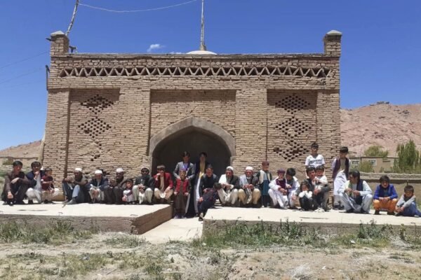 Nostalgia of Eid: Memories from My Village By Zakarya Farahmand Every community is recognized through its festivals, traditions, and cultural values. For us in Afghanistan, the two Eids (Eid Ul Fiter and Eid Ul Azha) are not only religious celebrations but also moments of collective joy, unity, and social connection. Since childhood, I used to count the weeks and days until the arrival of Eid with excitement and anticipation. These are the Eid traditions that I remember from my village in Malistan district of Ghazni province, where Eid celebrations transformed the entire community into one united family. Preparations for Eid in our village began even before the actual day of celebration. Three nights before Eid, villagers would organize a traditional gathering locally known as “Eid-e Morda-ha” عید م ( urرده ing these nights, people came together to offer prayers for deceased members of the village community through communal meals, gatherings, and mutual invitations. The village would be divided into two groups, and the male members of one side would become guests of families from the other side. The following night, the arrangement would be reversed. In this way, each household from one part of the village hosted a household from the other part, creating a strong spirit of hospitality, remembrance, and collective participation before Eid. These gatherings were not only social traditions but also acts of respect and prayer for those who had passed away. By the final night before Eid, all formal guest visits were completed so that families could freely prepare for the main celebration the next morning. Eid in our village is more than a celebration; it is a reflection of togetherness and happiness shared by the entire community. Days before Eid, families clean their homes, prepare food, and arrange the best facilities they can afford. On Eid, everyone wears either new clothes or their cleanest freshly washed clothes, making the atmosphere colorful and festive regardless of economic condition. On the morning of Eid, children wake up early with excitement while boys, girls, and women remain busy preparing the home for guests, cooking food, boiling eggs for traditional games, and getting ready for the celebration. At the same time, elders and heads of families first visit the homes of those who have recently lost loved ones. They offer condolences and spend time with grieving families so that nobody feels forgotten during Eid. After these visits, the men of the village gather in the mosque for Eid prayers. Once the prayers and supplications are completed, all male members of the village gather together in front of the village dome, each bringing one plate of food from their homes. Before serving the food, children, youth, and even adults gather to play the traditional boiled-egg game, one of the most exciting and enjoyable parts of Eid celebrations for the youth of the village.After the communal meal and Eid prayers (Dua), everyone begins greeting one another by shaking hands, hugging, and exchanging Eid wishes. Younger people respectfully greet elders and receive blessings in return. Then the most beautiful part of the celebration begins. People divide themselves into groups of around ten persons and start visiting every house in the village one by one. In our village of nearly twenty houses, no home is excluded. Visiting families during Eid is not merely a social custom but almost a collective responsibility for the male members of the community. Families welcome one another regardless of personal disagreements, social differences, or past conflicts. These visits continue until sunset, turning the entire village into one united family for the day. Hospitality also carries its own friendly competition. Villagers quietly observe which household has prepared the best food for Eid guests, adding a joyful and humorous spirit to the celebrations. One of the most beautiful aspects of this tradition is the atmosphere of mutual respect and social trust within the community. Even within the conservative structure of rural Afghan society, women of the household openly exchange Eid greetings and wishes with visiting guests without feelings of discomfort or social distance. Eid creates a rare sense of collective belonging in which community relationships become more important than social barriers. On the second and third days of Eid, men visit relatives living in nearby villages while also receiving guests from outside. At the same time, women continue their own Eid celebrations inside the village for nearly a week by visiting one another’s homes, sharing food, conversations, and happiness. Although I left my village nearly fifteen years ago, these traditions of Eid celebration still continue today. Yet for those of us living far from home, Eid often arrives through phone calls, photographs, and social media memories rather than through the warmth of collective village gatherings. Even after many years, the nostalgia of those simple celebrations, shared meals, boiled-egg games, and house-to-house visits remains deeply alive in my memory. Eid in our village is not only a religious festival; it is a celebration of unity, compassion, hospitality, respect, and belonging.