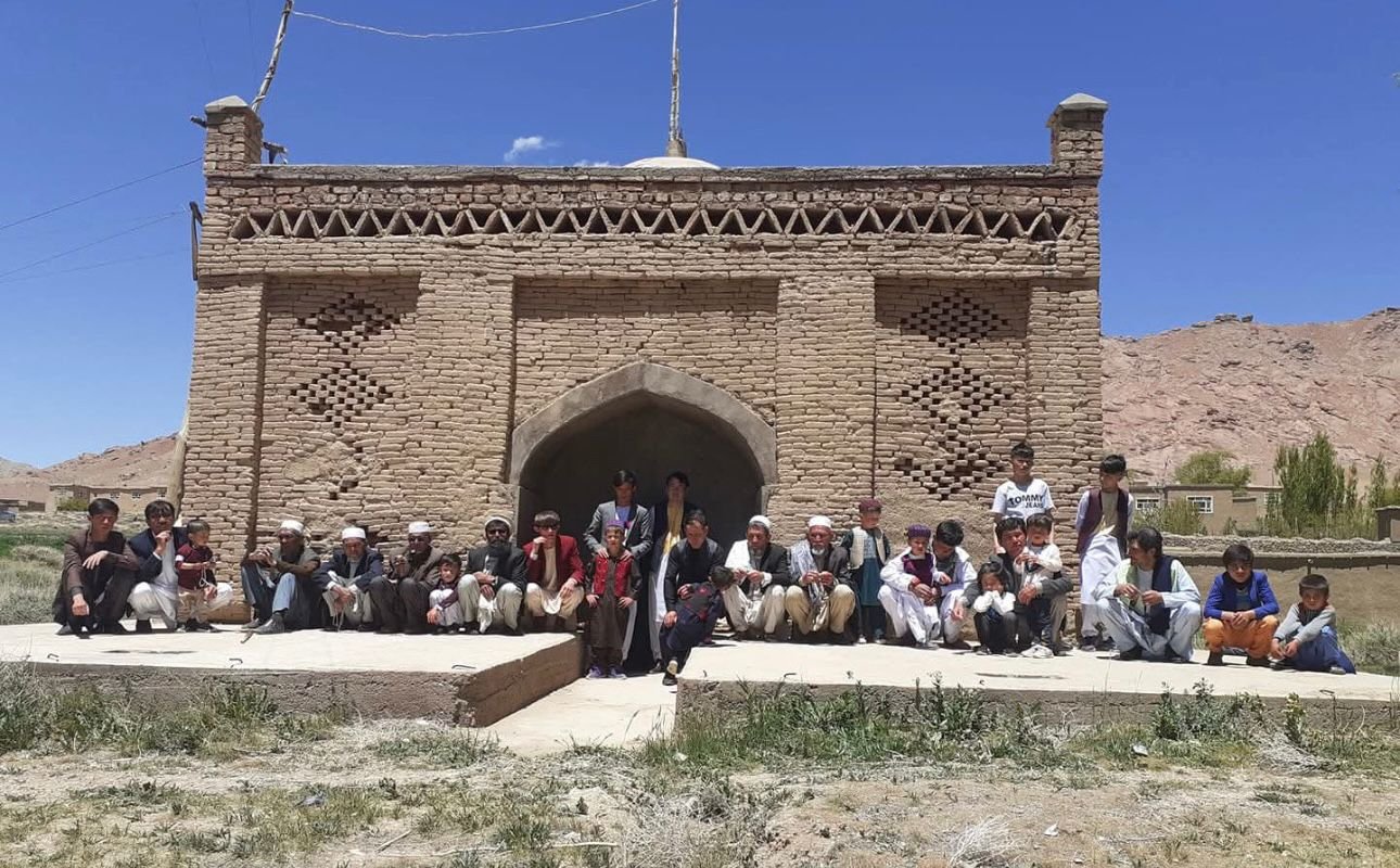 Nostalgia of Eid: Memories from My Village By Zakarya Farahmand Every community is recognized through its festivals, traditions, and cultural values. For us in Afghanistan, the two Eids (Eid Ul Fiter and Eid Ul Azha) are not only religious celebrations but also moments of collective joy, unity, and social connection. Since childhood, I used to count the weeks and days until the arrival of Eid with excitement and anticipation. These are the Eid traditions that I remember from my village in Malistan district of Ghazni province, where Eid celebrations transformed the entire community into one united family. Preparations for Eid in our village began even before the actual day of celebration. Three nights before Eid, villagers would organize a traditional gathering locally known as “Eid-e Morda-ha” عید م ( urرده ing these nights, people came together to offer prayers for deceased members of the village community through communal meals, gatherings, and mutual invitations. The village would be divided into two groups, and the male members of one side would become guests of families from the other side. The following night, the arrangement would be reversed. In this way, each household from one part of the village hosted a household from the other part, creating a strong spirit of hospitality, remembrance, and collective participation before Eid. These gatherings were not only social traditions but also acts of respect and prayer for those who had passed away. By the final night before Eid, all formal guest visits were completed so that families could freely prepare for the main celebration the next morning. Eid in our village is more than a celebration; it is a reflection of togetherness and happiness shared by the entire community. Days before Eid, families clean their homes, prepare food, and arrange the best facilities they can afford. On Eid, everyone wears either new clothes or their cleanest freshly washed clothes, making the atmosphere colorful and festive regardless of economic condition. On the morning of Eid, children wake up early with excitement while boys, girls, and women remain busy preparing the home for guests, cooking food, boiling eggs for traditional games, and getting ready for the celebration. At the same time, elders and heads of families first visit the homes of those who have recently lost loved ones. They offer condolences and spend time with grieving families so that nobody feels forgotten during Eid. After these visits, the men of the village gather in the mosque for Eid prayers. Once the prayers and supplications are completed, all male members of the village gather together in front of the village dome, each bringing one plate of food from their homes. Before serving the food, children, youth, and even adults gather to play the traditional boiled-egg game, one of the most exciting and enjoyable parts of Eid celebrations for the youth of the village.After the communal meal and Eid prayers (Dua), everyone begins greeting one another by shaking hands, hugging, and exchanging Eid wishes. Younger people respectfully greet elders and receive blessings in return. Then the most beautiful part of the celebration begins. People divide themselves into groups of around ten persons and start visiting every house in the village one by one. In our village of nearly twenty houses, no home is excluded. Visiting families during Eid is not merely a social custom but almost a collective responsibility for the male members of the community. Families welcome one another regardless of personal disagreements, social differences, or past conflicts. These visits continue until sunset, turning the entire village into one united family for the day. Hospitality also carries its own friendly competition. Villagers quietly observe which household has prepared the best food for Eid guests, adding a joyful and humorous spirit to the celebrations. One of the most beautiful aspects of this tradition is the atmosphere of mutual respect and social trust within the community. Even within the conservative structure of rural Afghan society, women of the household openly exchange Eid greetings and wishes with visiting guests without feelings of discomfort or social distance. Eid creates a rare sense of collective belonging in which community relationships become more important than social barriers. On the second and third days of Eid, men visit relatives living in nearby villages while also receiving guests from outside. At the same time, women continue their own Eid celebrations inside the village for nearly a week by visiting one another’s homes, sharing food, conversations, and happiness. Although I left my village nearly fifteen years ago, these traditions of Eid celebration still continue today. Yet for those of us living far from home, Eid often arrives through phone calls, photographs, and social media memories rather than through the warmth of collective village gatherings. Even after many years, the nostalgia of those simple celebrations, shared meals, boiled-egg games, and house-to-house visits remains deeply alive in my memory. Eid in our village is not only a religious festival; it is a celebration of unity, compassion, hospitality, respect, and belonging.